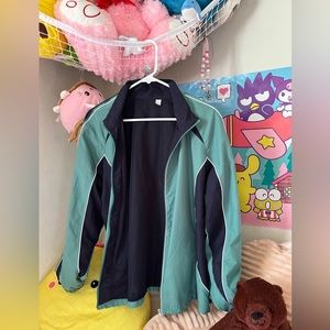 Street wear. Lightweight green, navy blue jacket.